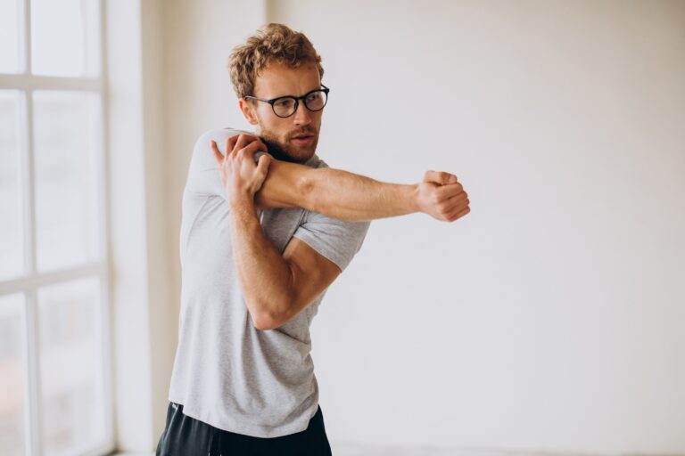 man practicing yoga mat home for shoulder pain relief