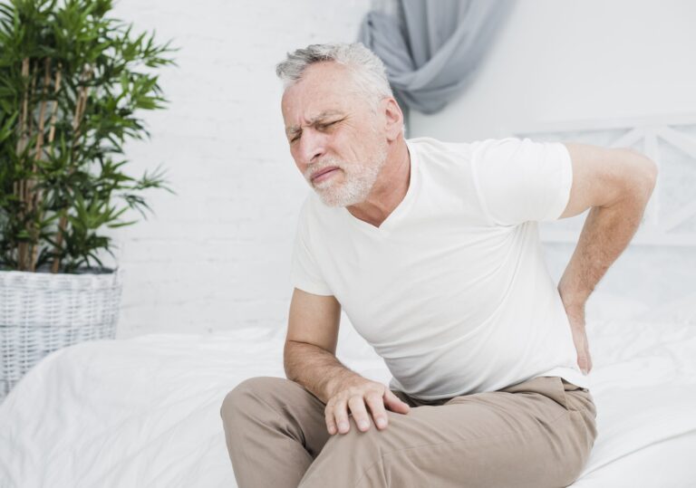 Elder man with serious lower back pain