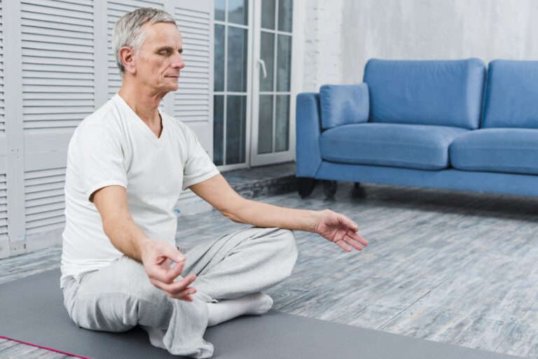 concentrated old man doing meditation for chronic pain
